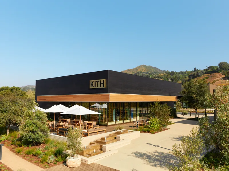 KITH Malibu at Cross Creek Ranch, a dark timber-clad storefront with a cedar soffit above the terrace