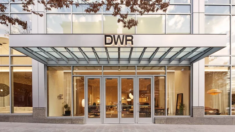 The Design Within Reach Salt Lake City entrance, a glass canopy above full-height doors with the furniture showroom lit inside